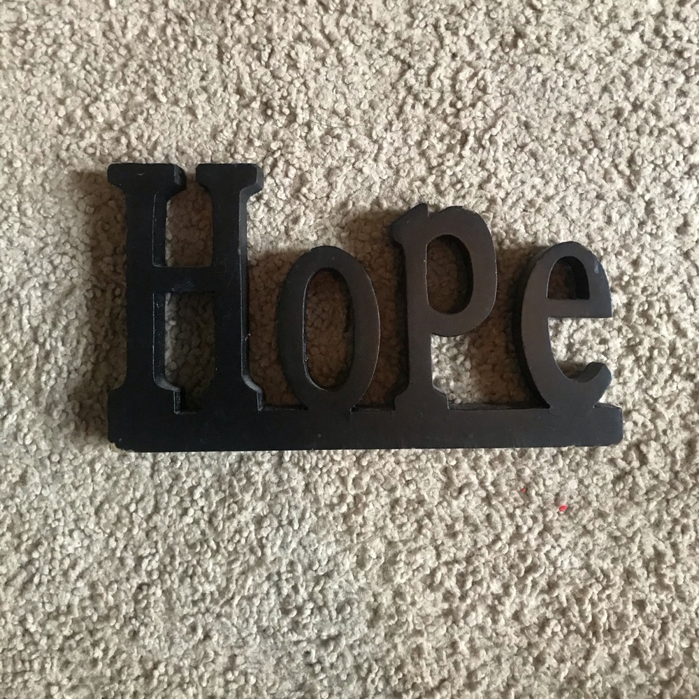 Black block letter “Hope” sign